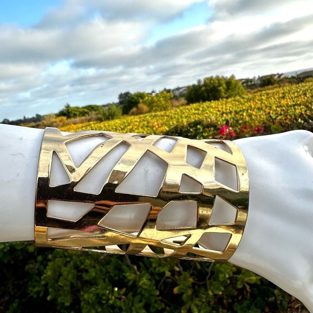 Gold tone cuff cut out long wide  bracelet